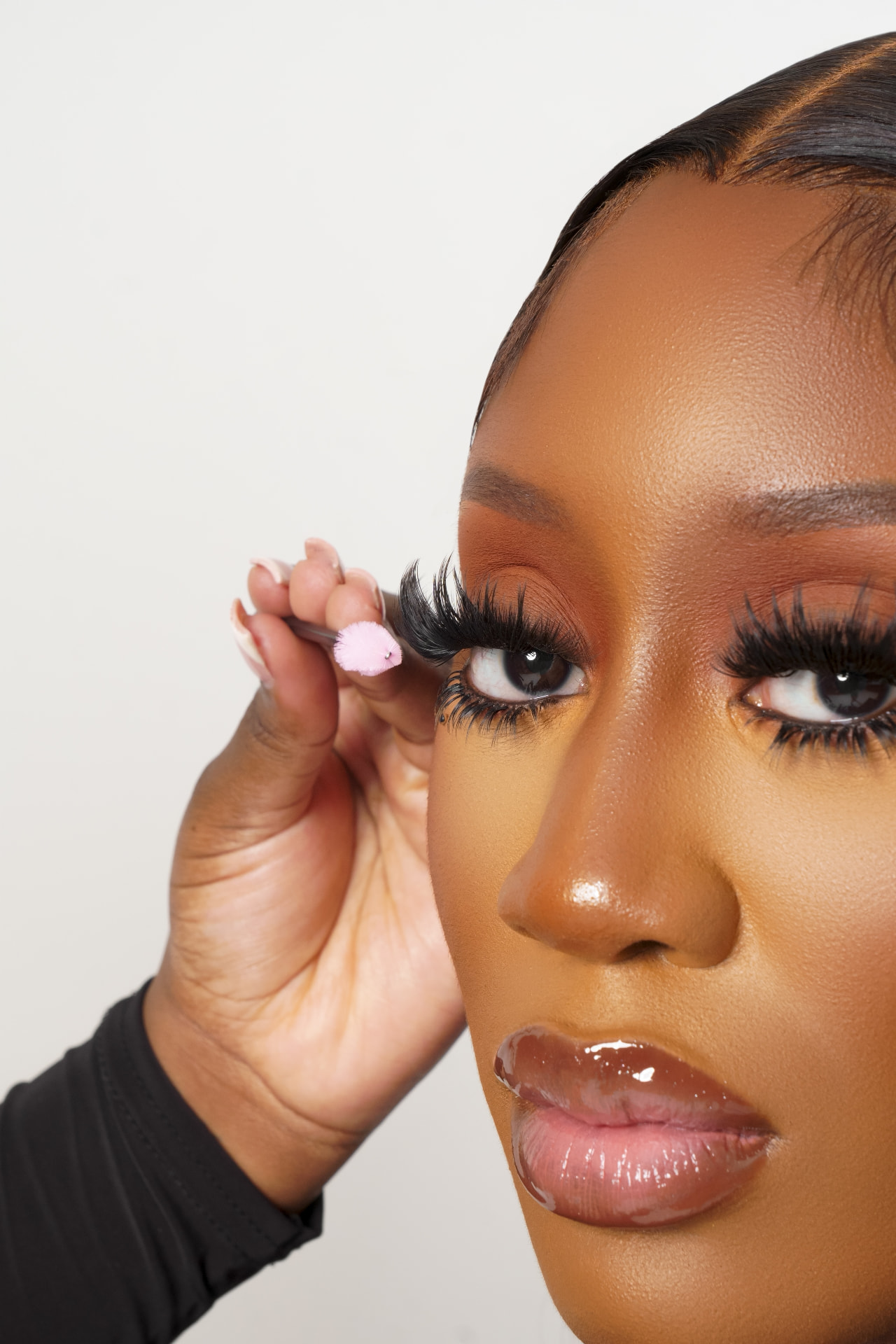Lash application during a Decardi Beauty training session